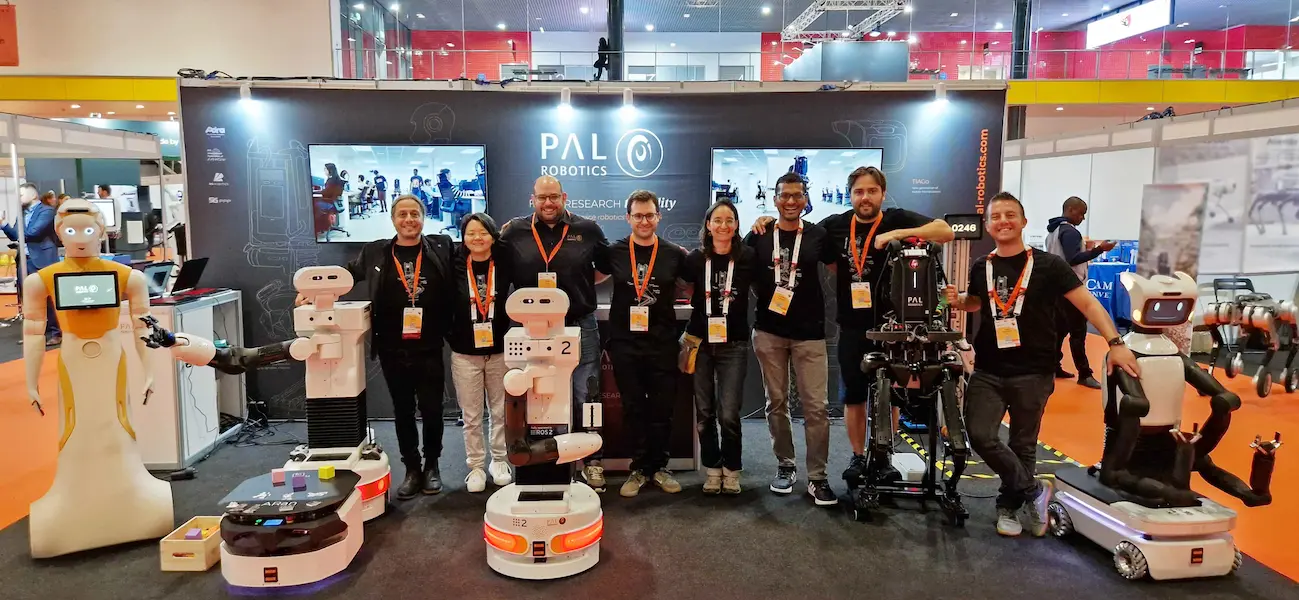 PAL Robotics' team at the ICRA 2023 conference discussing the project PILLAR-Robots with the robotic solutions including the latest generation mobile manipulator TIAGo Pro, the AMR ARan, the AI social robot ARI and the biped Kangaroo robot.